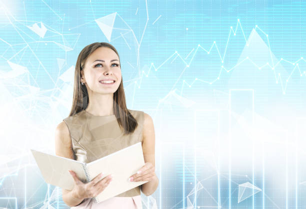 istock Smiling blonde woman with a copybook, graphs 848373726
