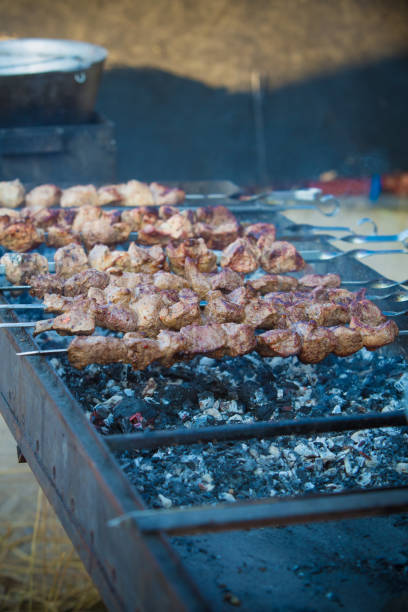 istock Barbecue. Fried shish kebab from pork meat. Fried chicken meat. Lamb on charcoal 848380936