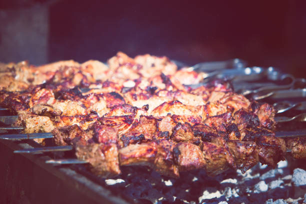 istock Barbecue. Fried shish kebab from pork meat. Fried chicken meat. Lamb on charcoal 848381394