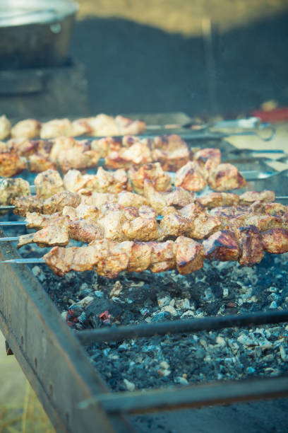 istock Barbecue. Fried shish kebab from pork meat. Fried chicken meat. Lamb on charcoal 848381456