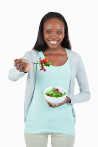 istock Young woman offering some salad 848384710