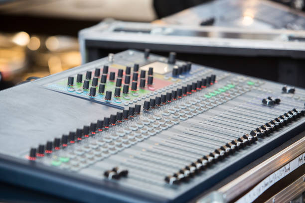 istock work place sound engineer's. mixing console. Mixer. The sound engineer's console. Sound engineer's fingers are pressing the button audio controller. 848387070