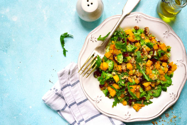 istock Autumn pumpkin salad with broccoli,dried cranberry,walnut and arugula 848387950