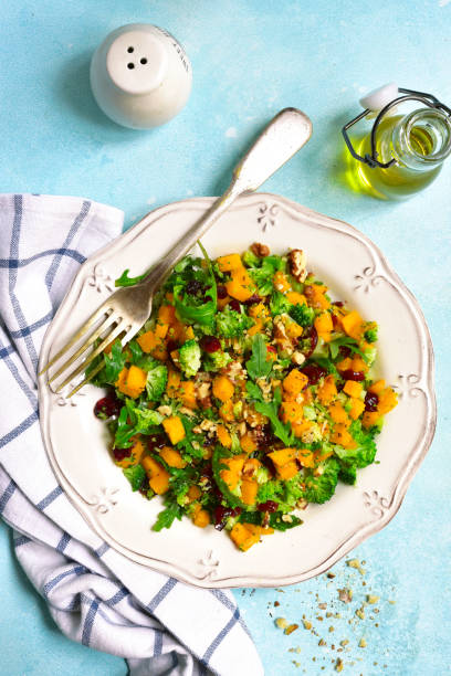 istock Autumn pumpkin salad with broccoli,dried cranberry,walnut and arugula 848387974