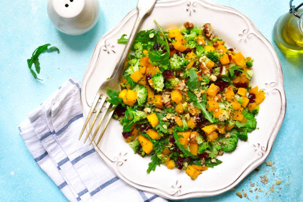 istock Autumn pumpkin salad with broccoli,dried cranberry,walnut and arugula 848388056