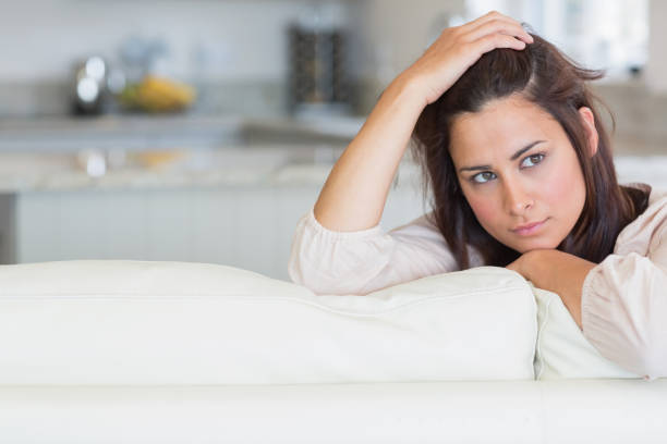 istock Woman holding hand on head 848390484