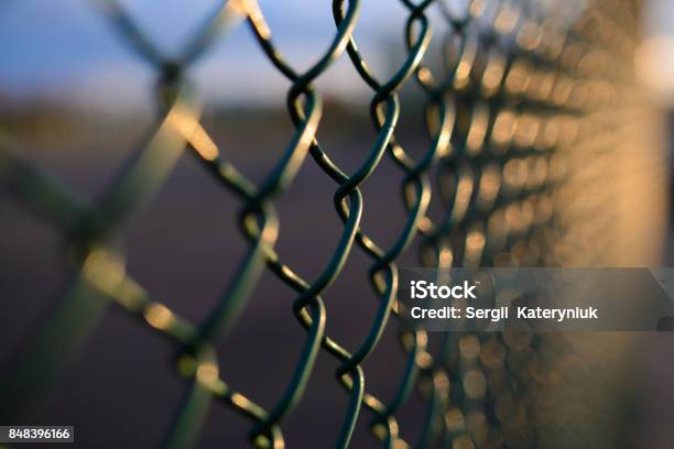 Fence With Metal Grid In Perspective Stock Photo - Download Image Now - Fence, Prison, Abstract