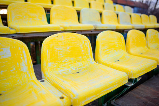 istock old yellow seat in stadium closeup 848397492