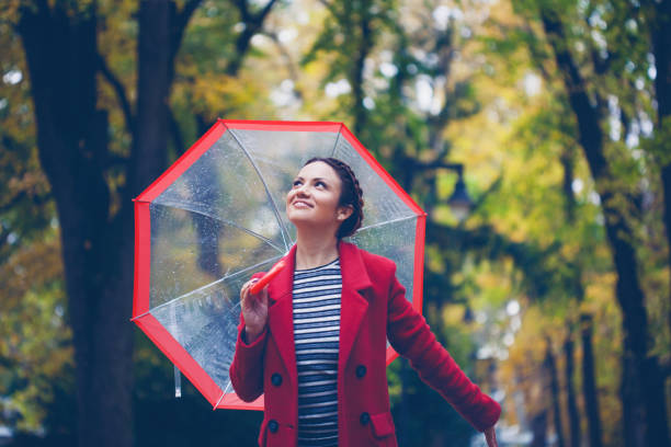 istock Beautiful young woman enjoying a rainy day 848408760