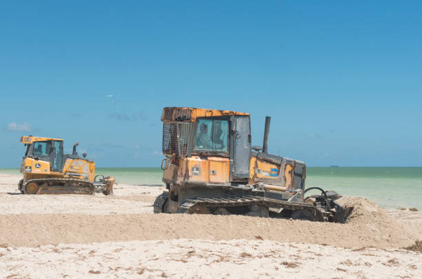 A bulldozer on a Sanibel Island Florida beach for a dredging project.