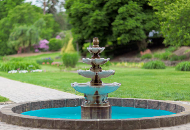 Water fountain in park stock photo
