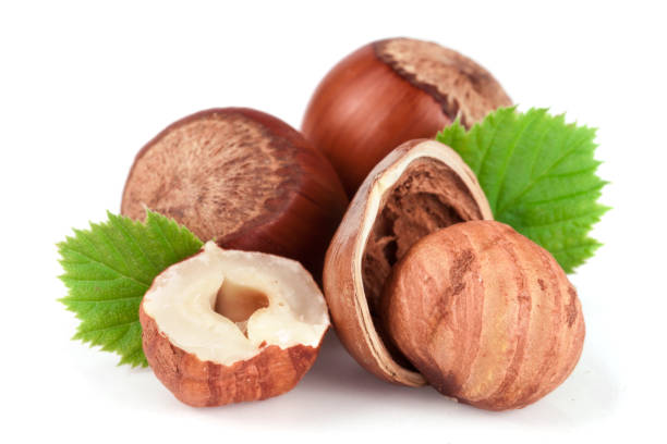 istock Hazelnuts with leaves isolated on white background 848425226