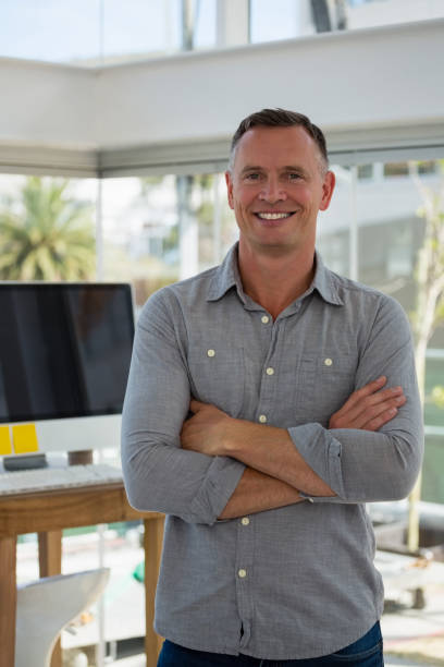 istock Portrait of confident businessman standing at studio 848430730