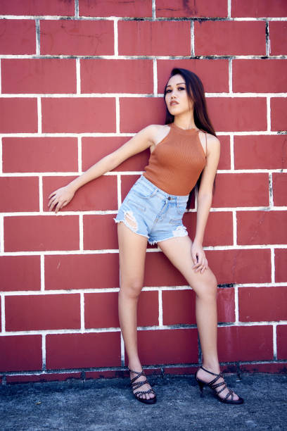 istock Beautiful woman posing -hand on wall 848435524
