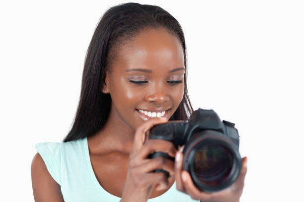 istock Smiling young photographer having a look at her camera 848436304