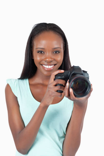 istock Smiling young photographer with her camera 848436322