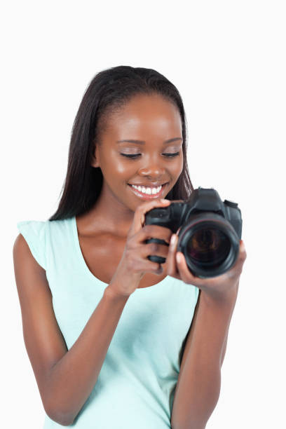 istock Young photographer taking a look at her cam 848436330