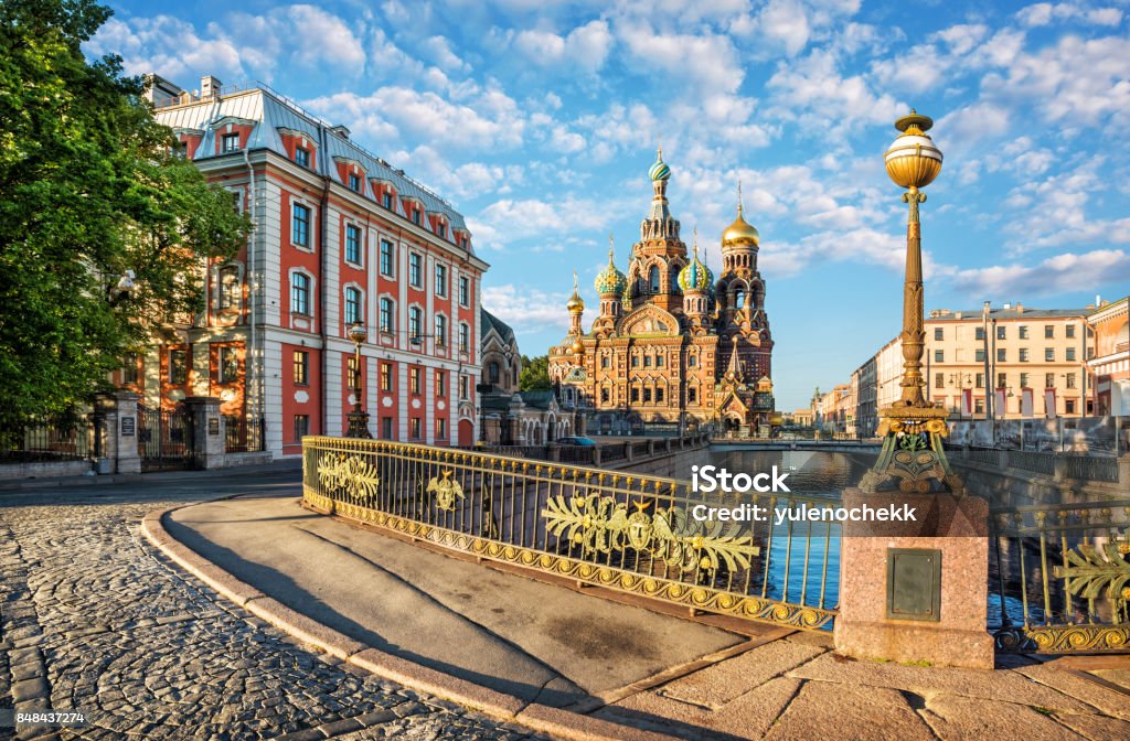Early morning at the Savior's Blood The Church of the Savior on Blood in St. Petersburg and a beautiful lantern in the light of the morning sun St. Petersburg - Russia Stock Photo