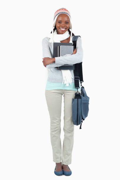 istock Smiling young female student with her books 848437628