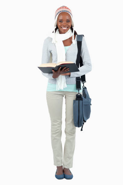 istock Smiling young female student having a look at her book 848438546