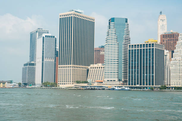 The gorgeous New York City skyline during sunrise as seen from Brooklyn in the summertime.