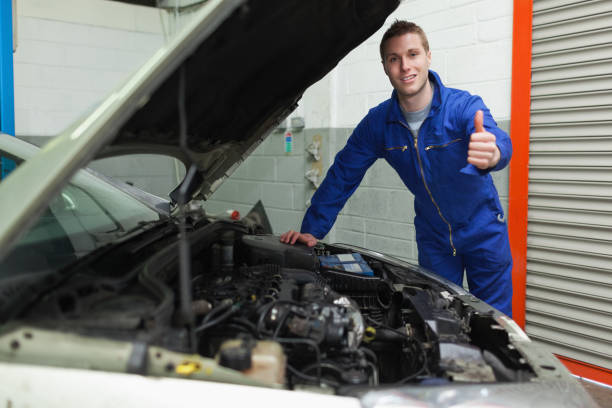 istock Mechanic by car gesturing thumbs up 848460296