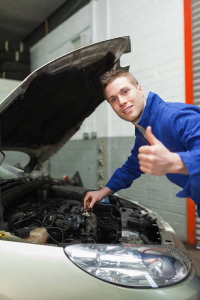 istock Auto mechanic by car gesturing thumbs up 848460446