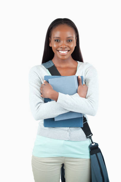 istock Smiling young female student with books and bag 848461076