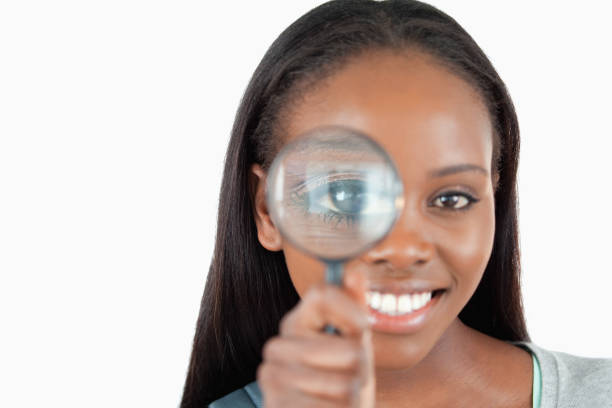 istock Smiling woman with magnifier 848461230