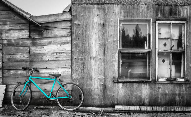 istock aqua blue bicycle leaning against old building. 848478140