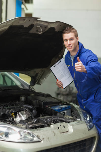istock Mechanic by car showing thumbs up 848481166