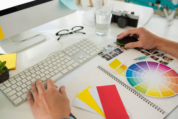 istock Cropped hands of businessman using computer at desk 848489670