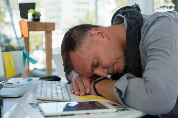 istock Businessman sleeping at desk in office 848491838