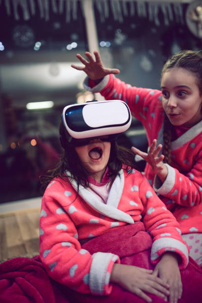 istock Scaring her Little Sister and Fighting over Virtual Reality Simulator 848492628