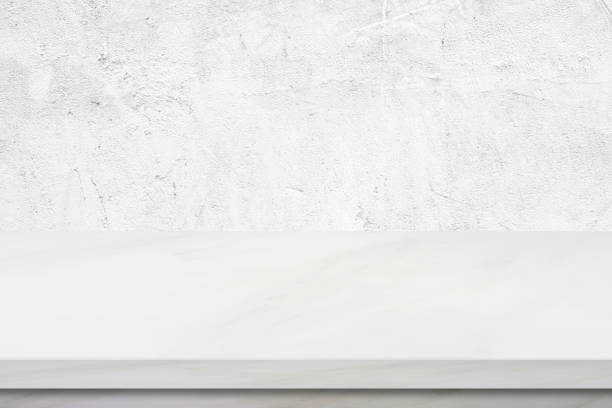 istock Empty white marble table over white cement wall background, product display montage 848495032