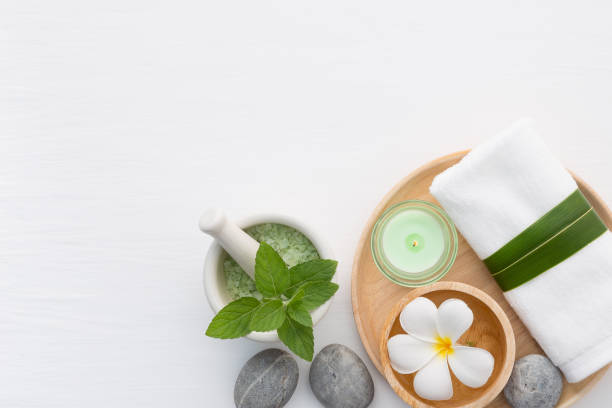 istock Spa concept with salt, mint, lotion, towel, candle, stone and flower on white background 848498836