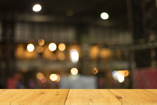 istock Blurred warm bokeh background with wooden on front. presentation abstract 848504366