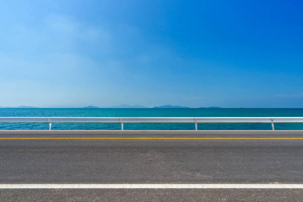 istock asphalt road and tropical beach 848504894