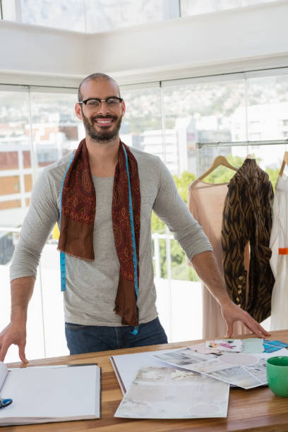 istock Fashion designer standing at table in office 848513004