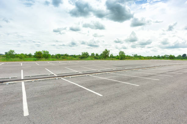istock Empty parking lot against a beautiful blue sky 848549304