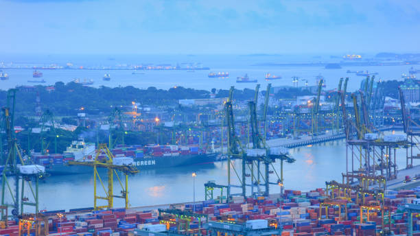 istock Container Cargo freight ship with working crane bridge in shipyard in singapore 848550218