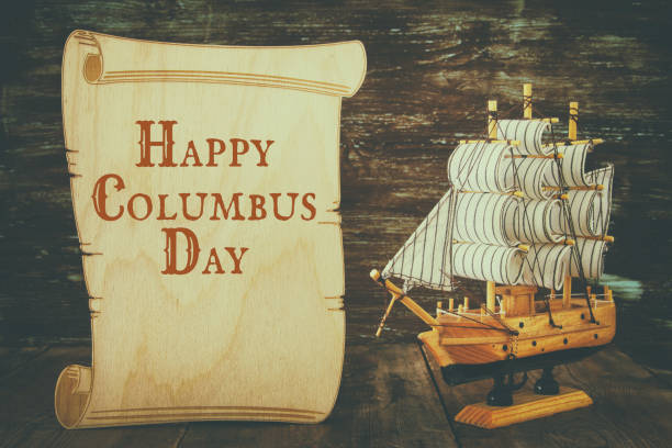 istock Columbus day concept with old ship over wooden background 848556794