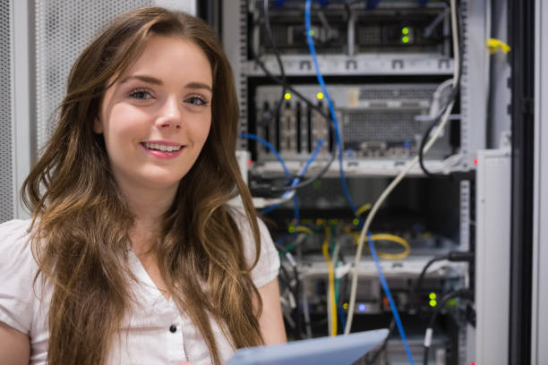 istock Smiling woman standing in front of servers 848556834