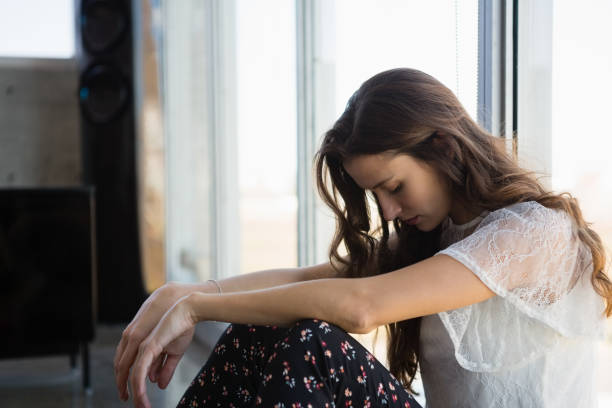 istock Tired businesswoman looking down 848557982