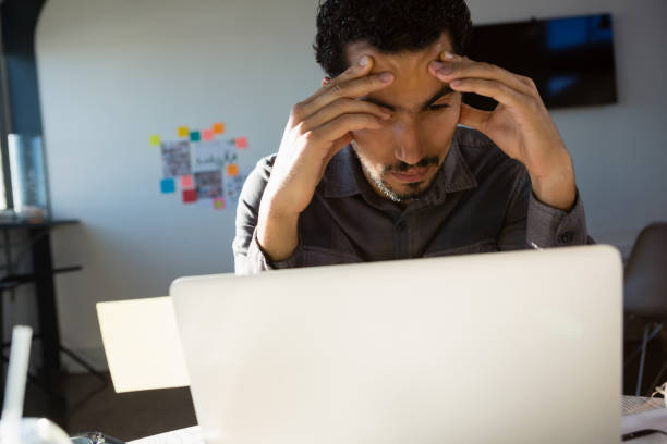 istock Frustrated businessman looking at laptop 848558026