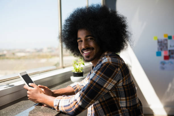 istock Portrait of smiling businessman using digital tablet 848558096