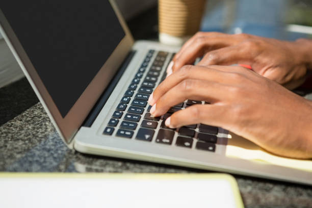 istock Cropped hands of businessman using laptop 848558176