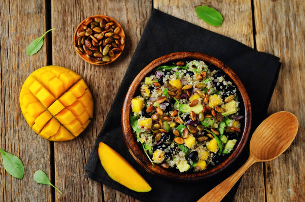Mango black bean arugula pumpkin seed quinoa salad