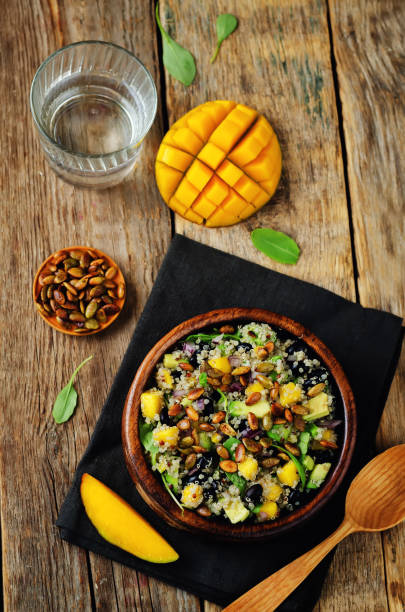 istock Mango black bean arugula pumpkin seed quinoa salad 848560796