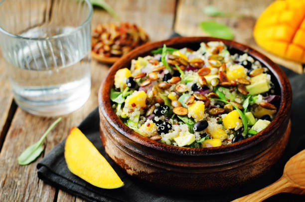 istock Mango black bean arugula pumpkin seed quinoa salad 848560816